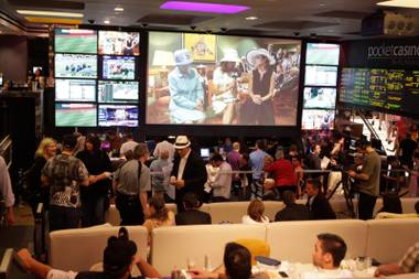 This sports bar on steroids has over 100 HD televisions and a gigantic TV in front of stadium-style rows of sofas