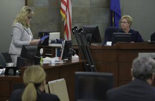 District Court Judge Jessie Walsh, right, listens as the court clerk reads a verdict in district court Wednesday, May 5, 2010. A jury found two companies that made and distributed the anesthetic propofol used at Desert Shadow Endoscopy Center liable on multiple counts. 