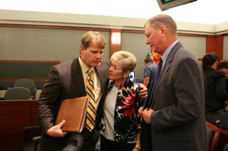 Attorney Robert Cottle stands with Henry and Lorraine Chanin after the jury's verdict is read May 7, 2011. Jurors awarded $500 million in punitive damage to the couple.