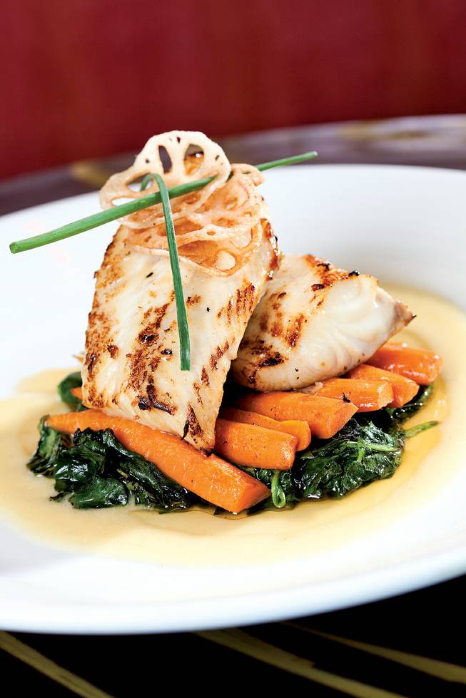 Roasted black cod with garlic spinach and sauteed baby carrots