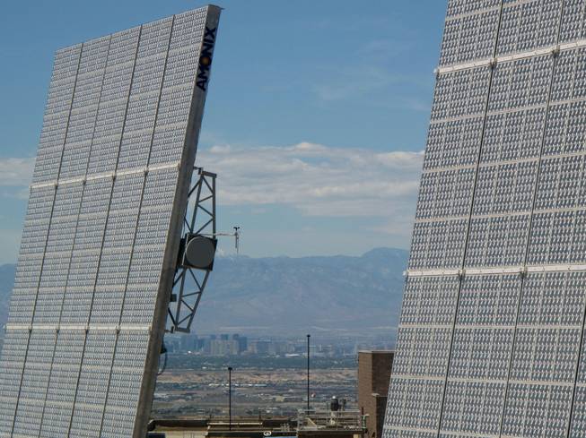 The Las Vegas Valley is seen between two solar panels at the Southern Nevada Water Authority's River Mountains Water Treatment Facility in Henderson.