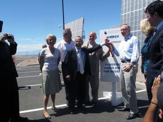 Sen. Harry Reid helps ceremonially activate a solar power plant Saturday with, from left, SNWA General Manager Pat Mulroy, TWC Construction CEO Matt Ryba, Amonix founder Vahan Garboushian and Amonix CEO Brian Robertson.