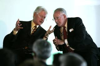 Former President Bill Clinton speaks with Mayor Oscar Goodman on Wednesday during an event to announce the first LEED Gold certified retrofit of a building in Nevada.