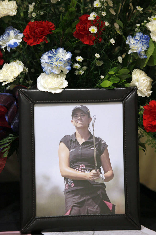 A portrait of LPGA golfer Erica Blasberg is displayed at her memorial service at Eagle Glen Golf Club in Corona, Calif., Wednesday, May 19, 2010.  