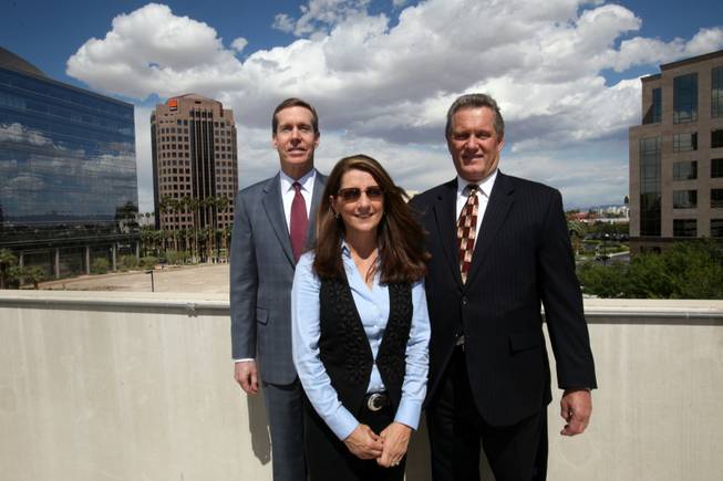Robert Boykin Jr., left, Lizz Stilley and Thomas Stilley of Crescent Real Estate Equities at the Hughes Center.