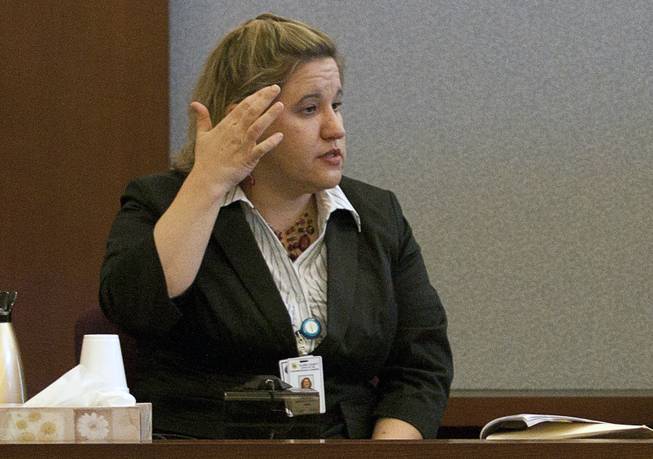 Clark County medical examiner Dr. Lisa Gavin describes head wounds that killed Damon Beal to the jurors during a coroner's inquest at Clark County Judicial Center on Friday, May 21, 2010. 