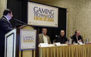 Saverio R. Scheri III, far left, managing director for WhiteSand Gaming, moderates a technology executive panel Tuesday during the Gaming Technology Summit at Green Valley Ranch. Chief information officers, from left, are David Farlin of Boyd Gaming, Marshall Andrew of the Cosmopolitan of Las Vegas and Steve Murphy of MGM Mirage.