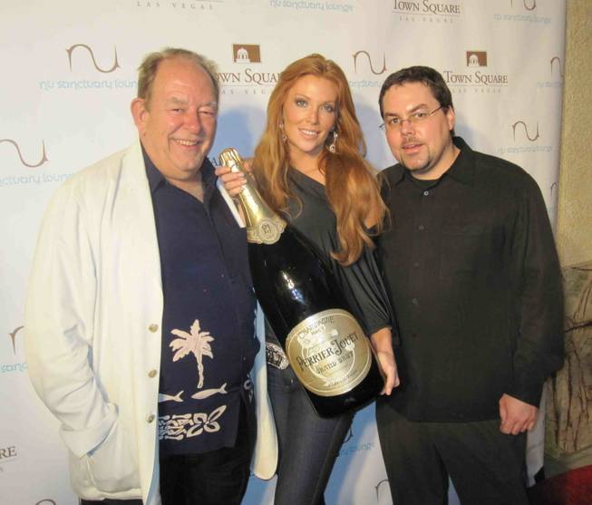 Robin Leach, Angelica Bridges and a guest at the grand ...