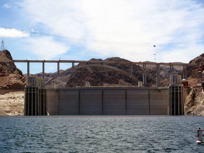 The Hoover Dam bypass bridge towers over the dam and Lake Mead on Thursday.