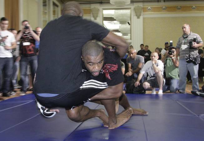 "Suga" Rashad Evans, right, takes down "King Mo" during a workout Thursday at the MGM Grand. Evans will face Quinton "Rampage" Jackson in UFC 114 on Saturday at the MGM Grand Garden Arena.