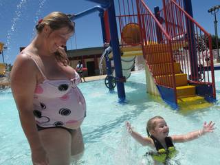 Tamie Luckey, 41, and her daughter JayLynn, 4, swim Saturday at the Parkdale Water Park.
