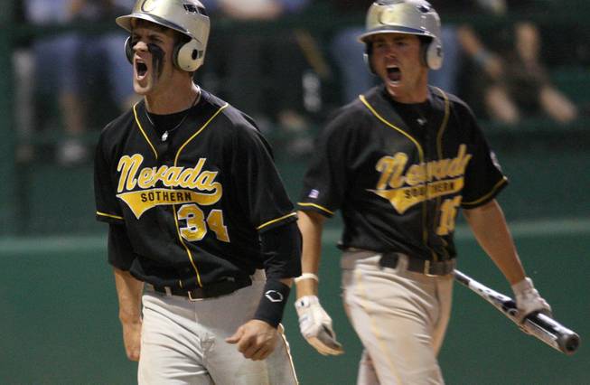 Bryce Harper, left, celebrates after scoring a run during the Junior College World Series. The College of Southern Nevada catcher was the first overall pick of the Washington Nationals in Monday's MLB First-Year Player Entry Draft.