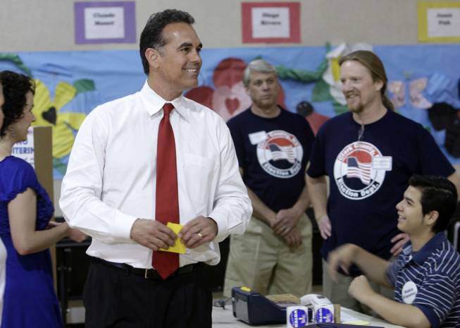 Republican U.S. Senate candidate Danny Tarkanian arrives to cast his ballot at Wasden Elementary School Tuesday, June 8, 2010. 