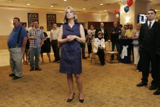 Sue Lowden watches election results come in at a primary election party for the Senate candidate Tuesday, June 8, 2010.