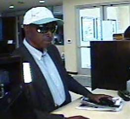 Surveillance video image of a man sought in the bank robbery. 
