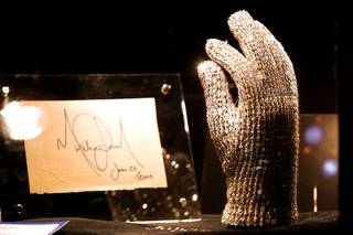 One of five Swarovski crystal-studded gloves made for Michael Jackson for the 1984 Victory Tour and an autograph made the day before he died are displayed at Julien's Auctions annual summer sale at Planet Hollywood. The glove eventually was sold for $160,000. The auction, which continues through Sunday, features 1,600 items from celebrities including Jackson, Anna Nicole Smith, Marilyn Monroe, Cher, Elvis Presley and Star Trek creator Gene Roddenberry.