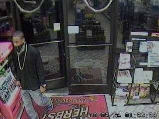 Surveillance photo of suspect in May 26 convenience store robbery.