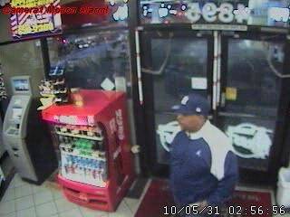 Surveillance photo of suspect in May 31 convenience store robbery.