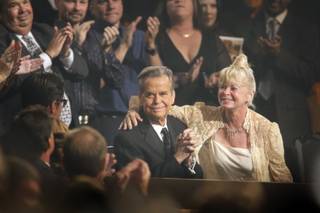 Dick Clark receives a standing ovation during the 37th Annual Daytime Emmy Awards at the Las Vegas Hilton on June 27, 2010. His wife Kari Wigton is at right.