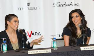 Kourtney Kardashian and Kim Kardashian announce their retail store Kardashian Khaos during a news conference at The Mirage on June 28, 2010.
