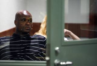 Former NBA player Antoine Walker waits to make an initial appearance in District Court at the Regional Justice Center in Las Vegas, Wednesday, June 30, 2010. Walker is facing felony bad check charges for allegedly failing to meet obligations to repay some $900,000 in gambling debts and penalties to three Las Vegas casinos.