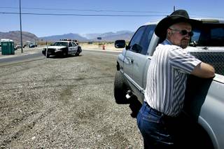 A man who declined to be identified waits out an evacuation for a fire on Mount Charleston Thursday, July 1, 2010.