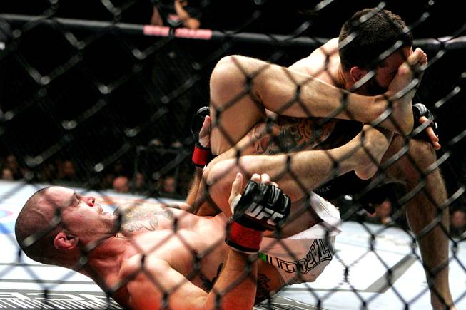 Chris Lytle kicks Matt Brown during their welterweight bout at UFC 116 Saturday, July 3, 2010. Lytle won by submission in the second round.