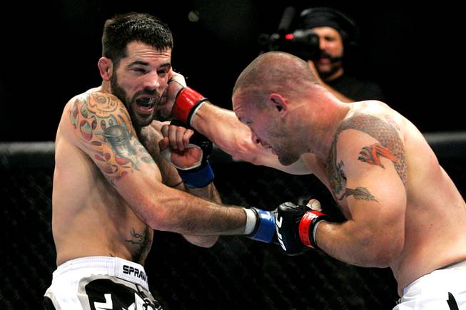 Chris Lytle hits Matt Brown with a right during their welterweight bout at UFC 116 Saturday, July 3, 2010. Lytle won by submission in the second round.