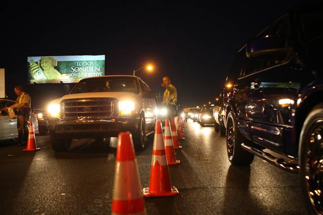 Drivers wait in line Friday, July 3, 2010, at a Metro Police DUI checkpoint on Nellis Boulevard south of East Lake Mead Boulevard.