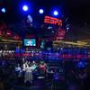Poker players compete at a featured table during the 41st annual World Series of Poker Main Event on Tuesday at the Rio.