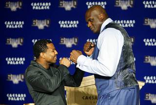 Boxer Shane Mosley and basketball great Shaquille O'Neal pose during a pre-fight 