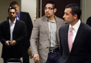 Boxer Antonio Margarito, center, arrives for a licensing hearing with the Nevada State Athletic Commission at the Sawyer State Building Friday, July 9, 2010. The commission disabled his application and recommended that he apply to get licensed in California first.