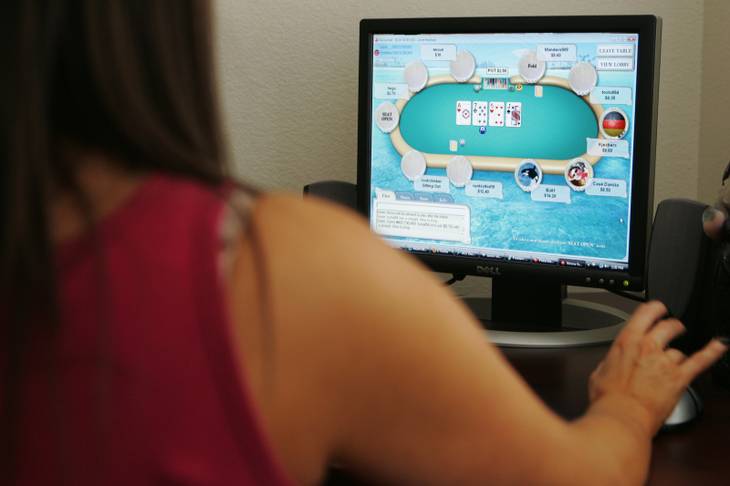 A woman who wants to remain anonymous plays poker online. 