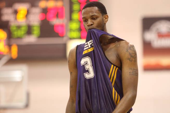 Devin Ebanks of the Lakers bites his jersey after being called for a foul basket during an NBA Summer League game against the Spurs Thursday at the Cox Pavilion.