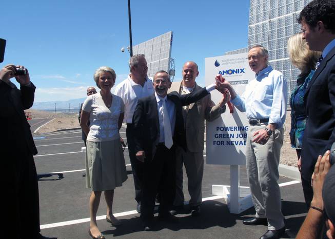 Sen. Harry Reid helps to ceremonially activate a solar power plant May 15 with, from left, SNWA General Manager Pat Mulroy, TWC Construction CEO Matt Ryba, Amonix founder Vahan Garboushian and Amonix CEO Brian Robertson.