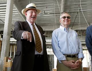 Las Vegas Mayor Oscar Goodman, left, and Sen. Harry Reid tour construction of the Smith Center on Saturday. Reid faces Republican and Tea Party favorite Sharron Angle this November in his bid to keep representing Nevada.