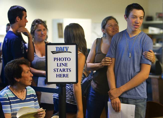 Shane Marshall, right, 16, a Foothill High School student, gets a hug from his aunt, Cris Marshall, while waiting in line at the Department of Motor Vehicles office in Henderson Monday, August 2, 2010. School officials on Wednesday will consider a policy that would prohibit students from getting driver's licenses if they cut classes.