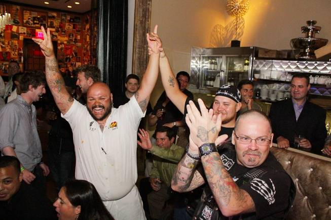 Jake Mual celebrates after winning First Food & Bar's Wing Throwdown at the Palazzo.