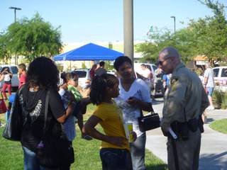 Metro Police chat with neighbors Tuesday at the Walnut Community Center during a National Night Out event.