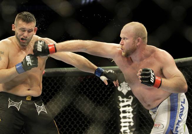 Tim Boetsch, right, punches Todd Brown at UFC 117 Saturday in Oakland, Calif. Boetsch won by unanimous decision.