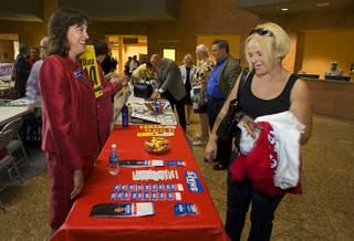 Michele Shafe, left, candidate for county assessor, talks with Kirstin Peart during a candidate day on Wednesday at the County Government Center. Shafe is the assistant director in the Clark County Assessor's Office. The event is chance for county employees and the public to talk to candidates for public office.