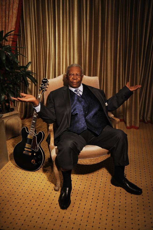 B.B. King poses with a Lucille Gibson electric, backstage at his B.B. King's Blues Club at Mirage.
