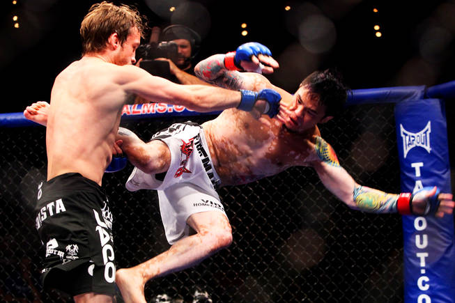 Brad Pickett catches Scott Jorgensen in the air during their WEC bantamweight fight at WEC 50 inside The Pearl at The Palms Wednesday, August 18, 2010 in this file photo.