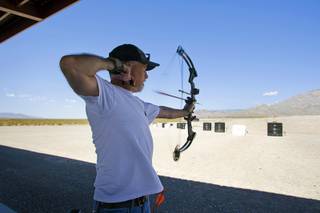 Eugene Hallett lets an arrow fly at the Clark County Shooting Park Friday, August 27, 2010. The $63 million shooting park gets rave reviews from shooting enthusiasts but is not making enough money to cover operational expenses.