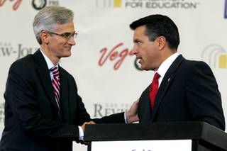 Rory Reid and Brian Sandoval shake hands following a debate on education between the gubernatorial candidates Sunday, August 29, 2010.