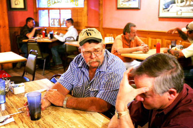 While dining at the Owl Club Cafe for dinner, State Assemblyman Pete Goicoechea speaks with mining industry consultant Jake Margolis, right, in Eureka, Nev., Wednesday, September 1, 2010.