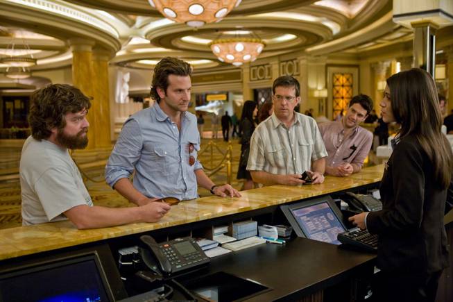 "The Hangover" actors, from left, Zach Galifianakis, Bradley Cooper, Ed Helms and Justin Bartha, appear in a scene at Caesars Palace's reception area.
