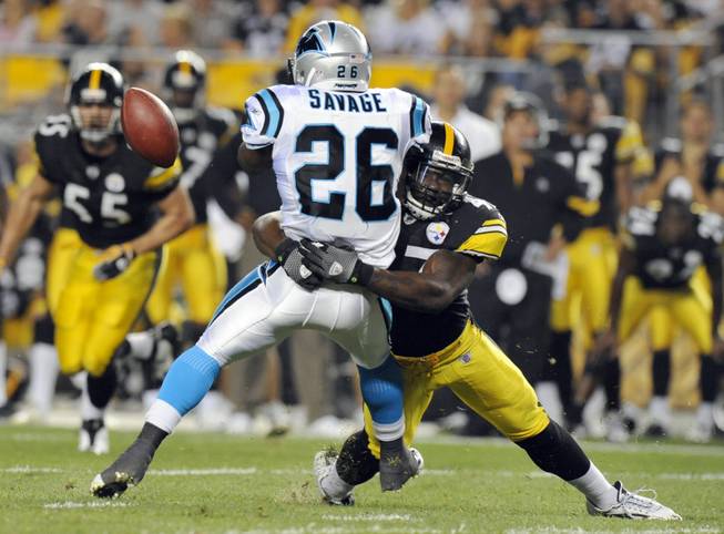 Pittsburgh Steelers linebacker Stevenson Sylvester (47) hits Carolina Panthers running back Dantrell Savage (26) as Savage tries to make a catch during the second quarter of an NFL preseason football game in Pittsburgh, Thursday, Sept. 2, 2010.  Pittsburgh won 19-3.