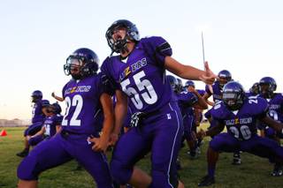 Durango running back Antonio Nieves (22) and offensive lineman Tyler Lavin (55) get pumped up by chanting the Samoan Haka war dance with their teammates before Friday's game against Basic. Basic won the game, 22-14.