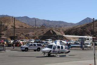 Emergency crews work to rescue five people, including three who were injured, on Friday at Lake Mohave. The rescue operation closed the Willow Beach launch ramp for about three hours.